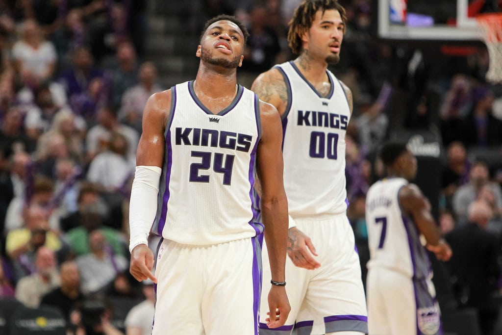 Sacramento Kings players looking disappointed on the field